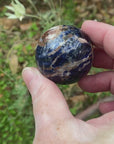 Video shows a polished Sodalite sphere 4cm in diameter.