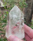 Video shows a polished clear quartz generator with lots of beautiful inclusions and high clarity. H 9.5cm W 5.3cm D 5cm