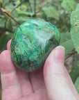 Video shows a polished piece of azurite and malachite with deep hues of blue and green in a marbled pattern.