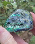 Video shows a polished piece of azurite and malachite with deep hues of blue and green in a marbled pattern.