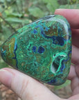 Video shows a polished piece of azurite and malachite with deep hues of blue and green in a marbled pattern.
