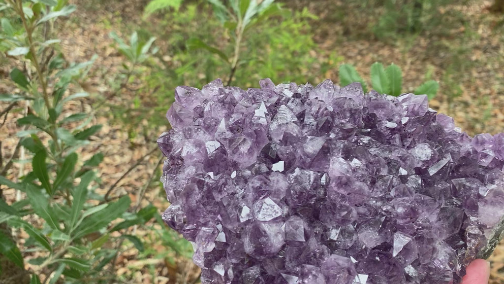 Video shows an amethyst cluster, purple in colour. and weighing 2.45kg. 