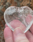 Video shows an A grade polished clear quartz heart with high clarity and inclusions. W 6.5cm