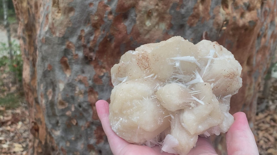 Video shows a specimen piece of Stilbite/Zeolite. 