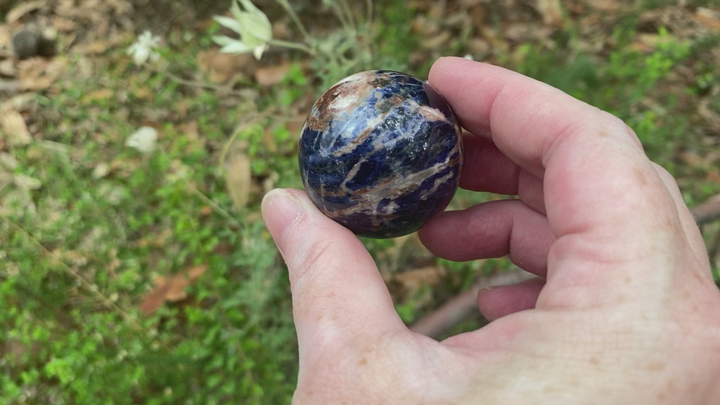 Video shows a polished Sodalite sphere 4cm in diameter. 