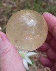 Video shows a polished golden calcite sphere Diameter 4cm. 