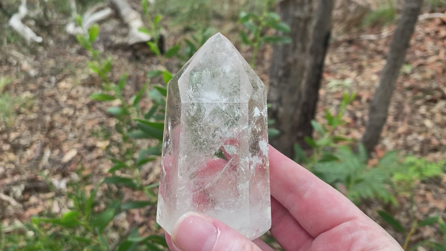  Video shows a polished clear quartz generator with lots of beautiful inclusions and high clarity. H 9.5cm W 5.3cm D 5cm