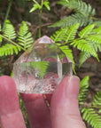 Video shows an A grade polished clear quartz generator with high clarity and inclusions. H 7.5cm W 5cm D 4cm