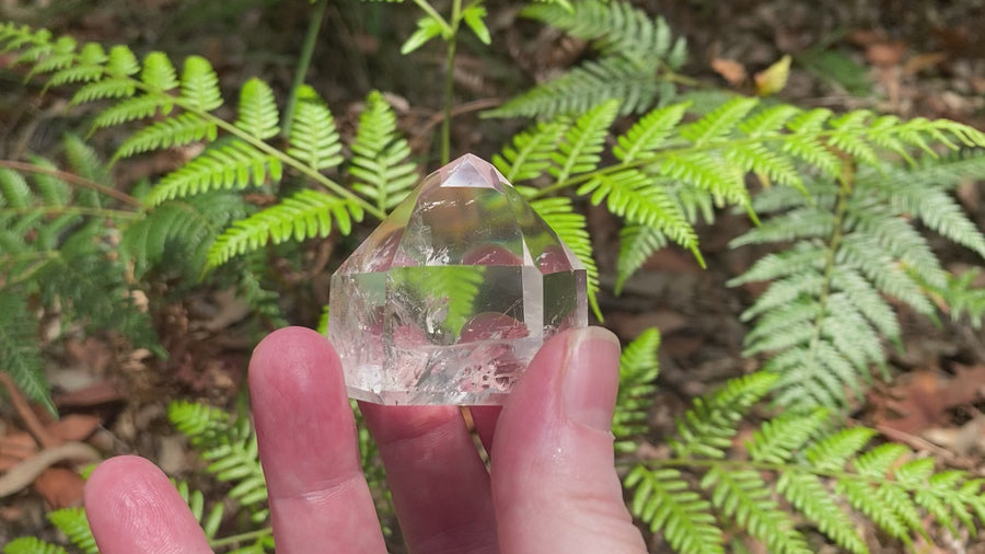 Video shows an A grade polished clear quartz generator with high clarity and inclusions. H 7.5cm W 5cm D 4cm