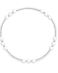 Picture shows a sterling silver beaded bracelet with white agate beads in groups of three at five different parts of the bracelet. 