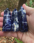 Video shows three sodalite generators. Deep blue in colour with white markings and banding. 