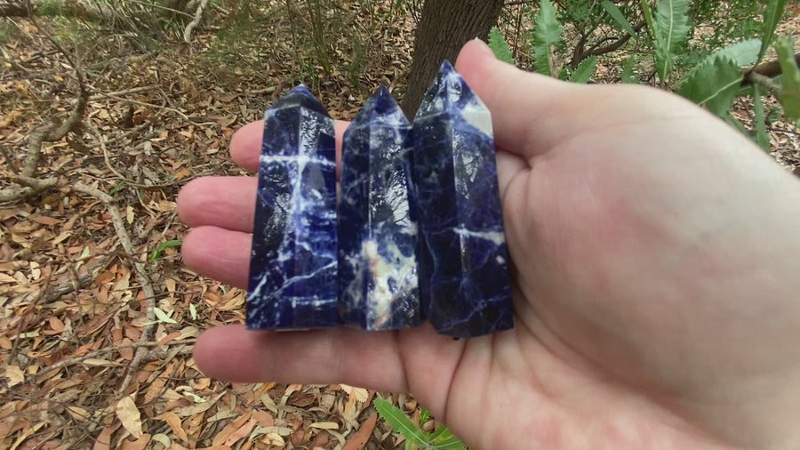 Video shows three sodalite generators. Deep blue in colour with white markings and banding. 