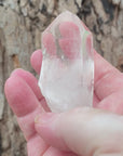 Video shows a natural clear quartz point with a thumb notch. H 8cm W 5.5cm D 4cm