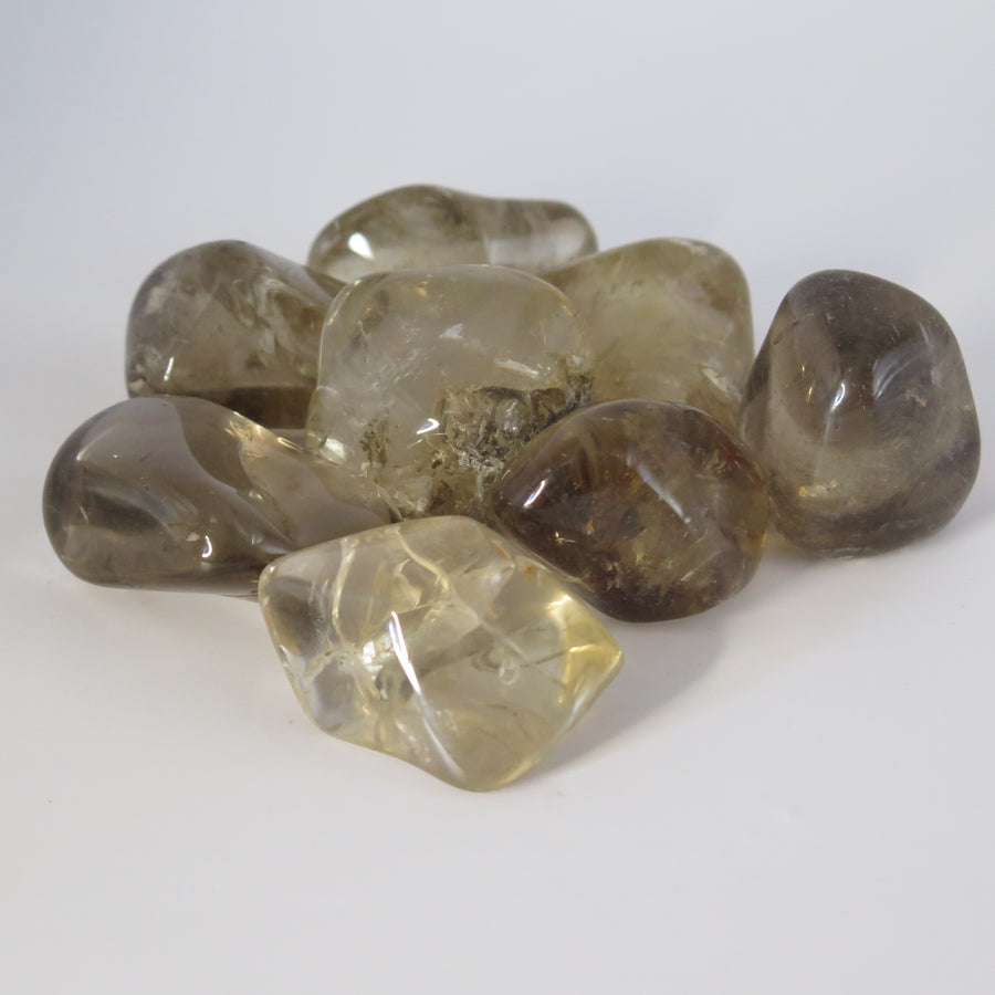 Image shows A grade Smokey Quartz polished tumble stones. Brownish to light grey in colour and  translucent. 